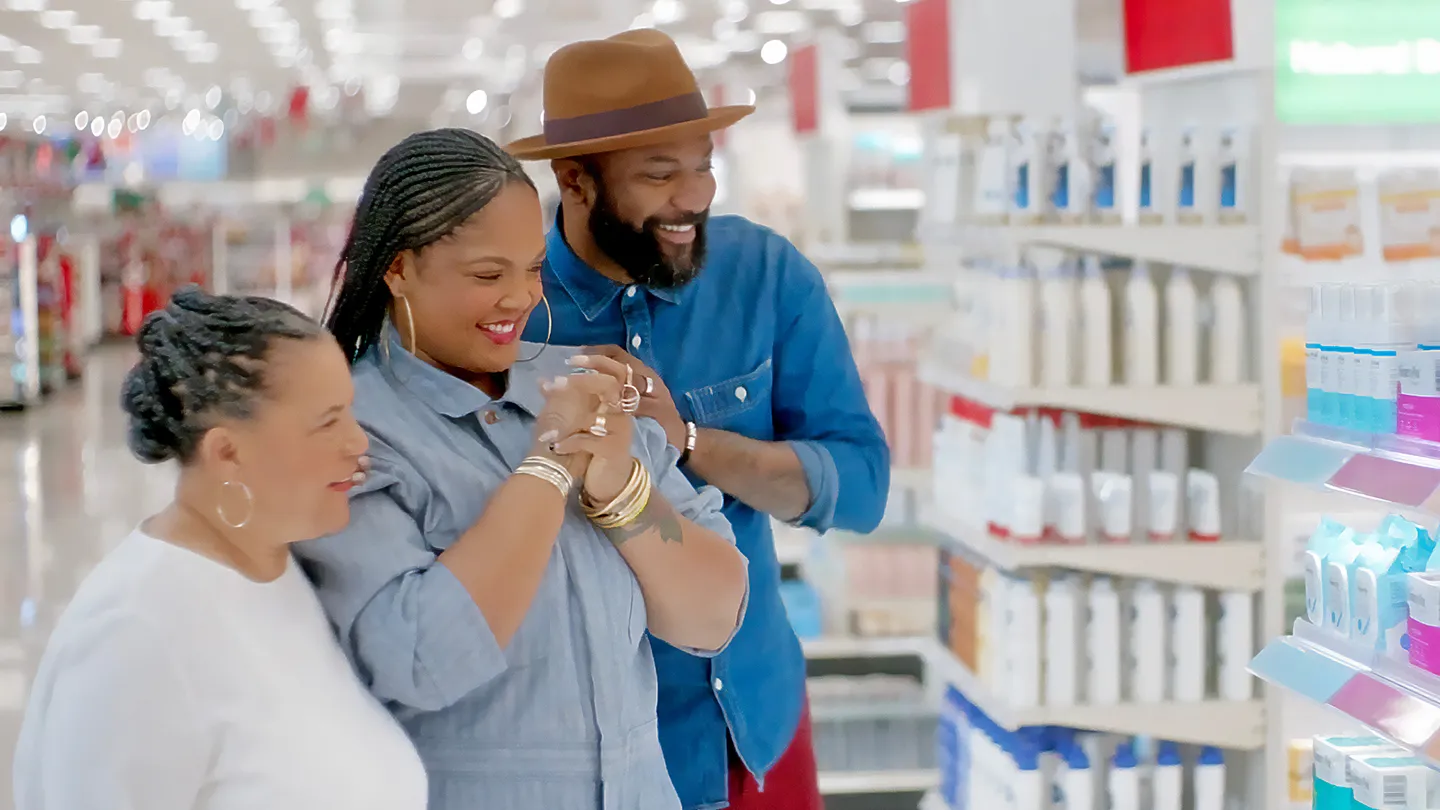 Three people shopping at a Target store